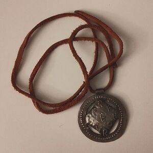 Stamped metal REFLEKTOR pendant (Arcade Fire merch)